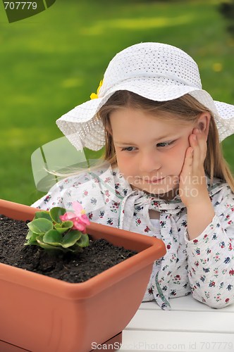 Image of Little girl  - gardening