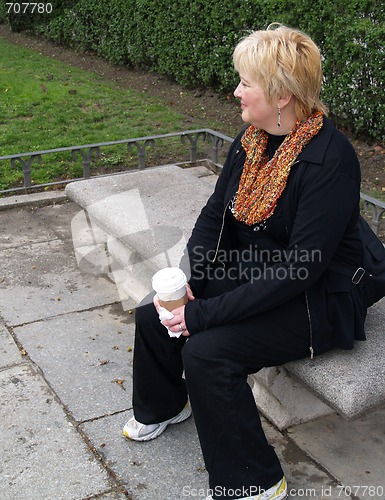 Image of Mature Woman on park bench