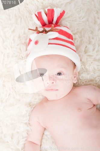 Image of Newborn baby in chritstmas hat