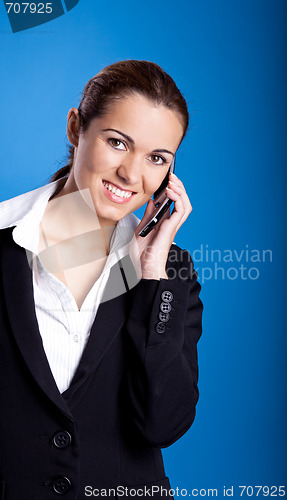 Image of Businesswoman calling at phone