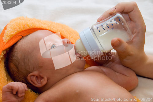 Image of Baby boy and feeding bottle