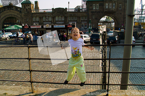 Image of Little funny girl in the city