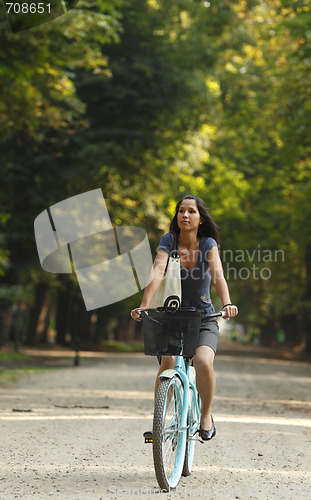 Image of Woman Riding A Bicycle