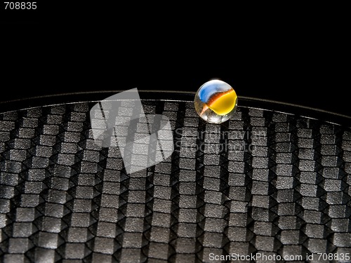 Image of Colored Marble on Black Grid