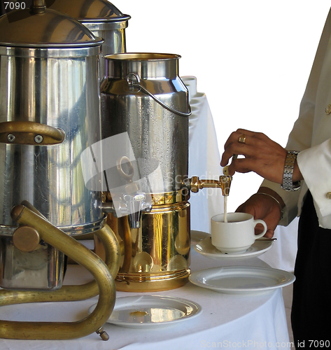 Image of Pouring milk in a cup of tea