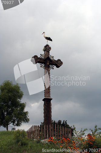 Image of A Stork on a Cross