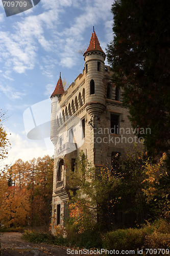 Image of The castle in Gothic style on a background of paints of autumn