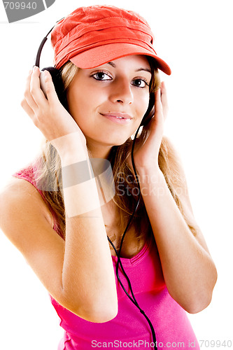 Image of Young woman listen music