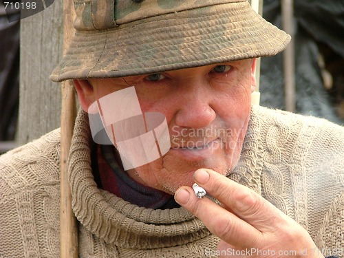 Image of Old man smoking