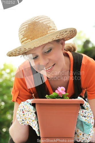 Image of Young woman - gardening