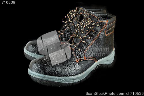 Image of moist modern working boots