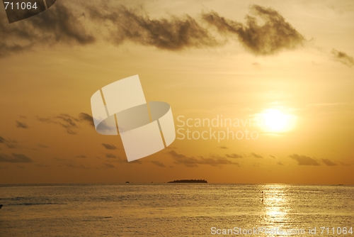 Image of Beautiful orange sunset on a tropical beach