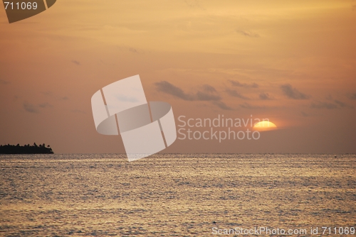 Image of Beautiful orange sunset on a tropical beach