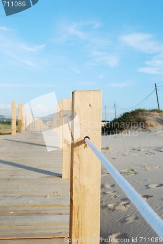 Image of Close up of a boardwalk entering the beach