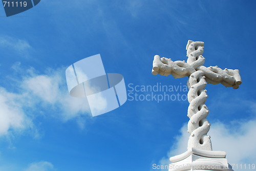 Image of Cross in clouds and blue sky
