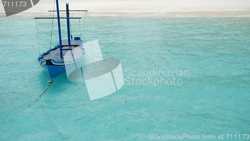 Image of Typical Maldivian boat on blue ocean