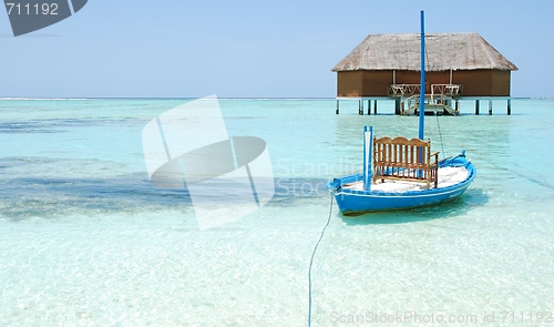 Image of Honeymoon villa in Maldives and typical boat