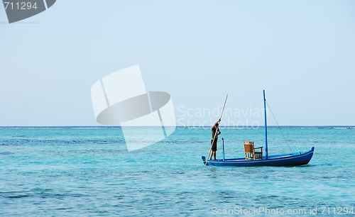 Image of Typical Maldivian boat on blue ocean