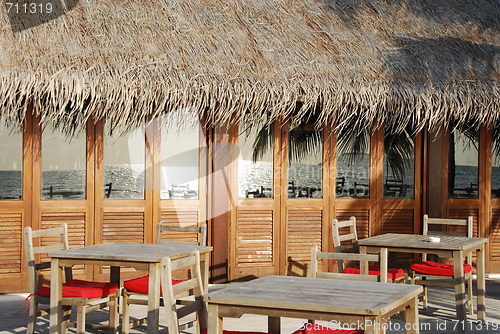 Image of Beach restaurant view in Maldives (ocean reflection)