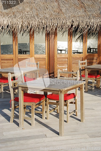 Image of Beach restaurant view in Maldives (ocean reflection)