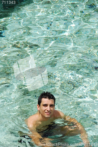 Image of Young man relaxing and smiling in Maldives (ocean background)