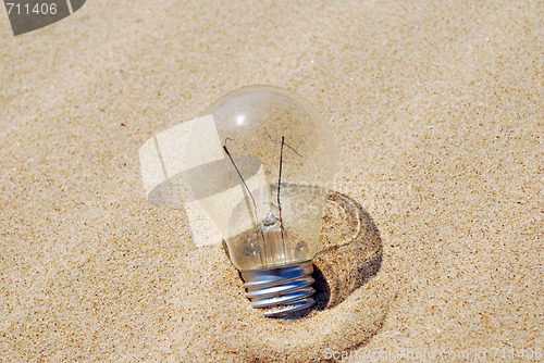 Image of Lightbulb on sand (global warming)