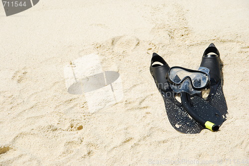 Image of Snorkel equipment on a tropical sandy beach