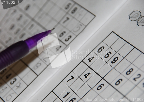 Image of Pencil on a sudoku grid (shallow depth of field)