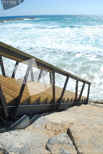 Image of Wooden stairs or path to the bright ocean