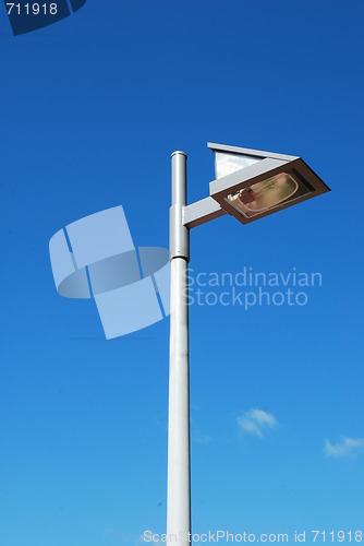 Image of Modern street lamp with blue sky background