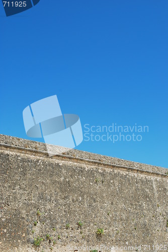 Image of Ancient stonewall with sky background