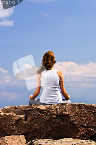 Image of Young girl meditating