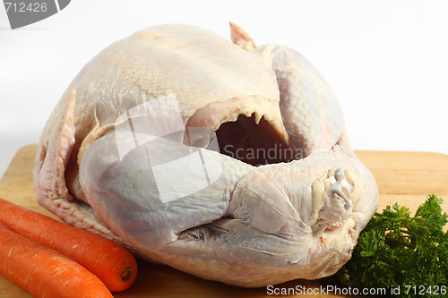 Image of Raw turkey on a board