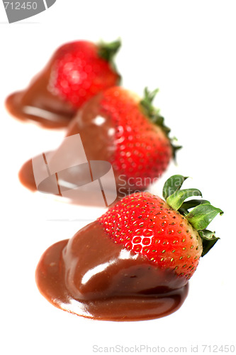 Image of A row of chocolate dipped strawberries