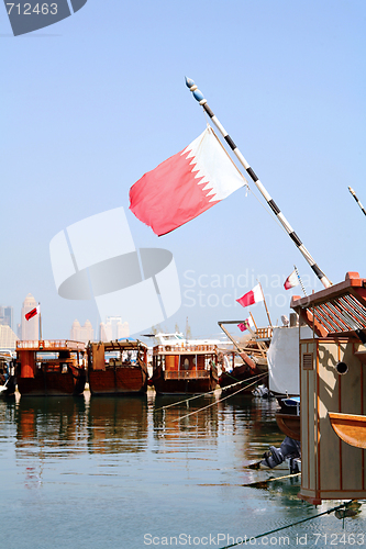 Image of Qatar dhow harbour and flag