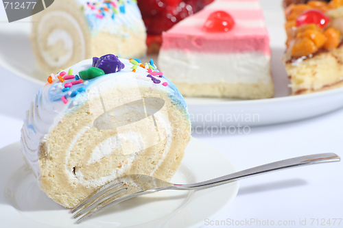Image of Sponge roll and plate of cakes