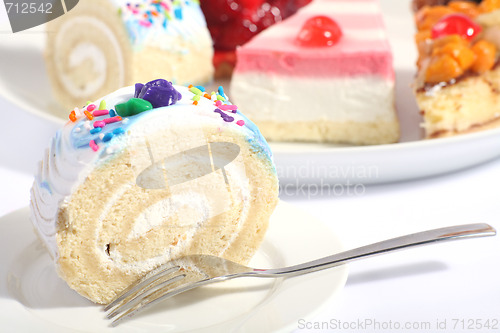 Image of Sponge roll and plate of cakes