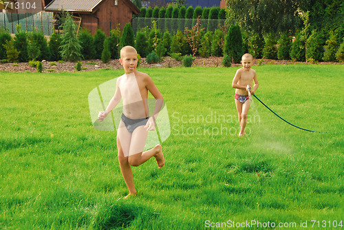 Image of boys play on the grass