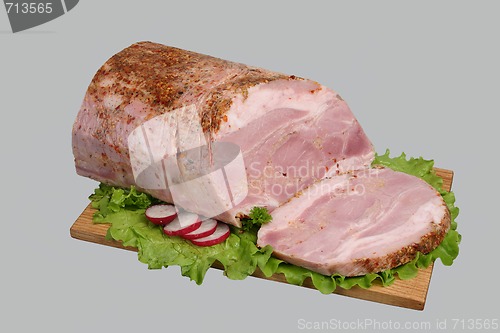 Image of Smoked meat on wooden board.