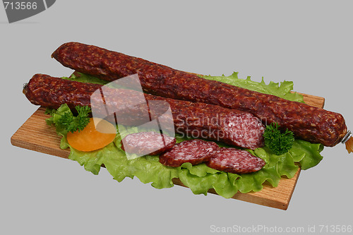 Image of Smoked sausage on wooden board 2