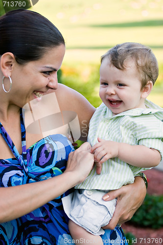 Image of Happy Mother Holding Her Baby