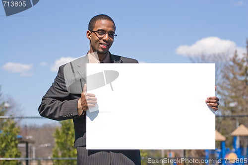 Image of Man Holding a Sign