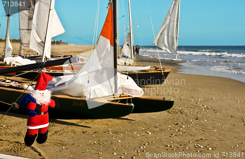 Image of Santa Claus goes to the beach