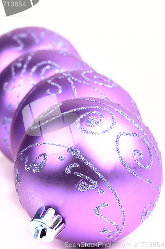 Image of four violet christmas ball