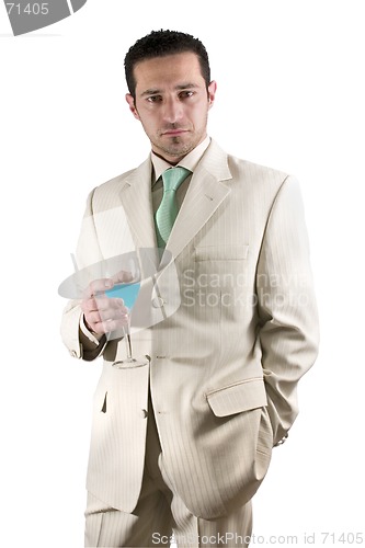 Image of Businessman celebrating with a glass of drink in a white suit
