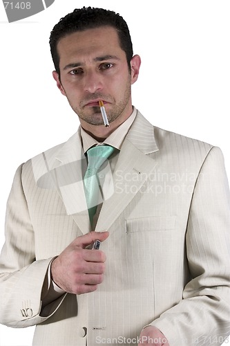 Image of Businessman lighting up a cigarette