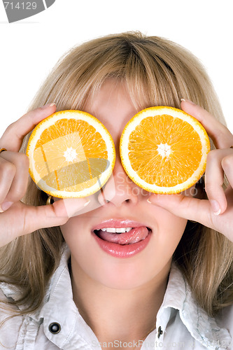 Image of Portrait of the funny girl with oranges over white