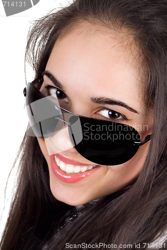 Image of Portrait of the smiling girl in sunglasses. Isolated