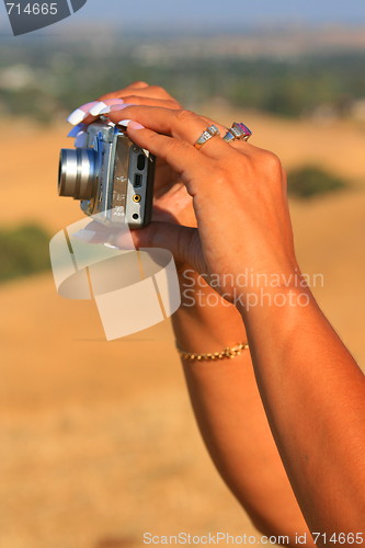 Image of Womans Hands Holding Digital Camera