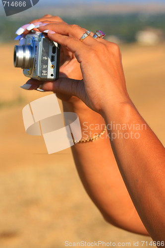 Image of Womans Hands Holding Digital Camera